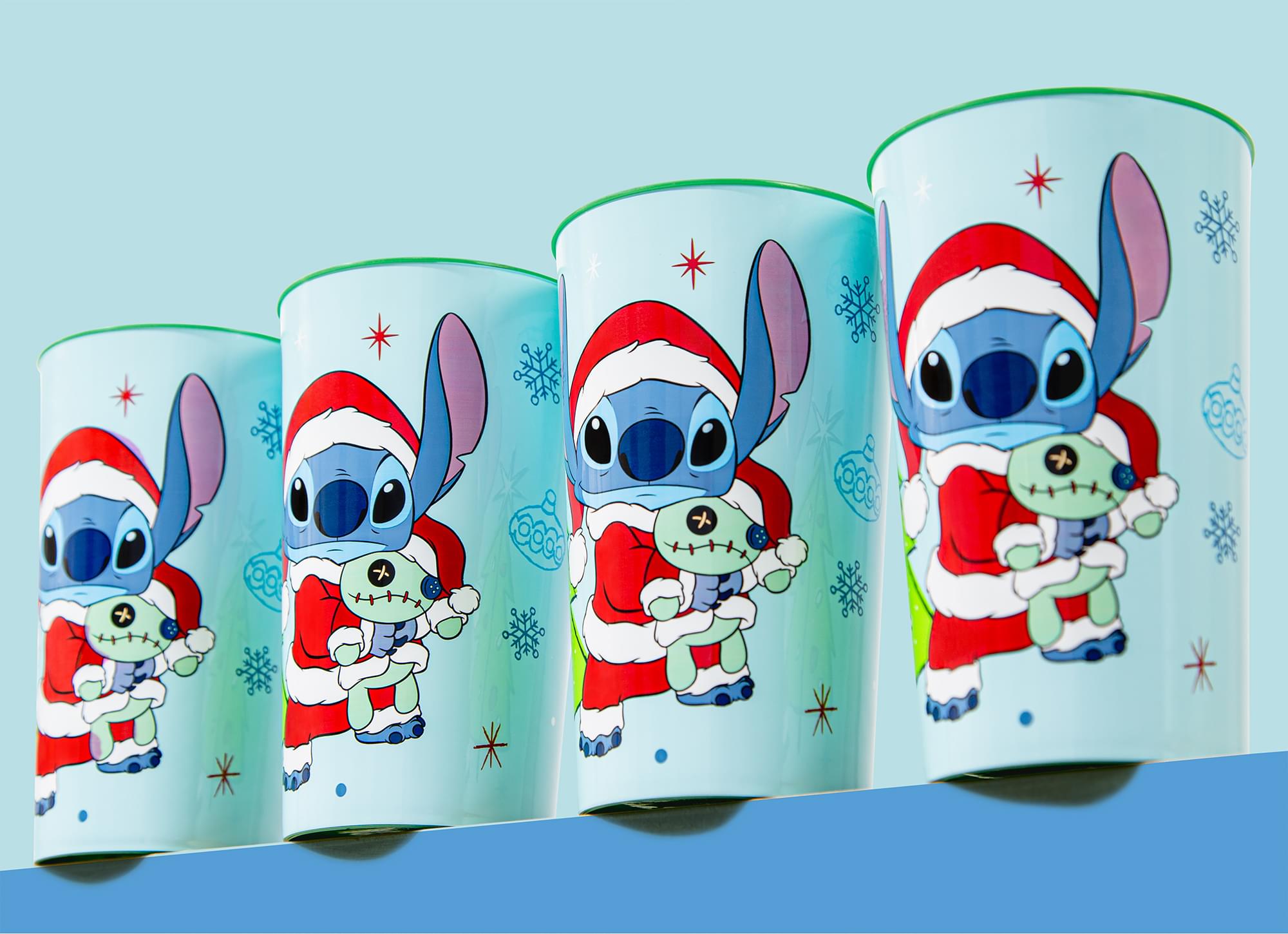 Alt View 1. Silver Buffalo - Disney Lilo & Stitch Santa Stitch 4-Piece Plastic Cup Set | Each Holds 22 Ounces - Blue.