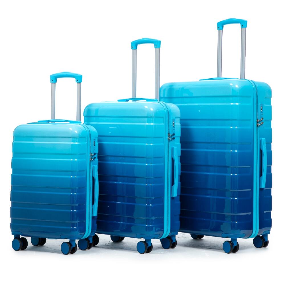 The image shows three blue suitcases of different sizes lined up next to each other.