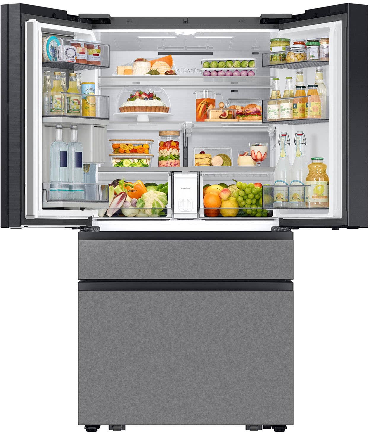 The image shows a refrigerator with its door open, revealing a variety of food items inside. There are several bottles of juice and water, as well as a variety of fruits, including apples, oranges, and grapes. The refrigerator also contains a cake, which is placed on a shelf. The assortment of food items and drinks suggests that the refrigerator is well-stocked and ready for use.