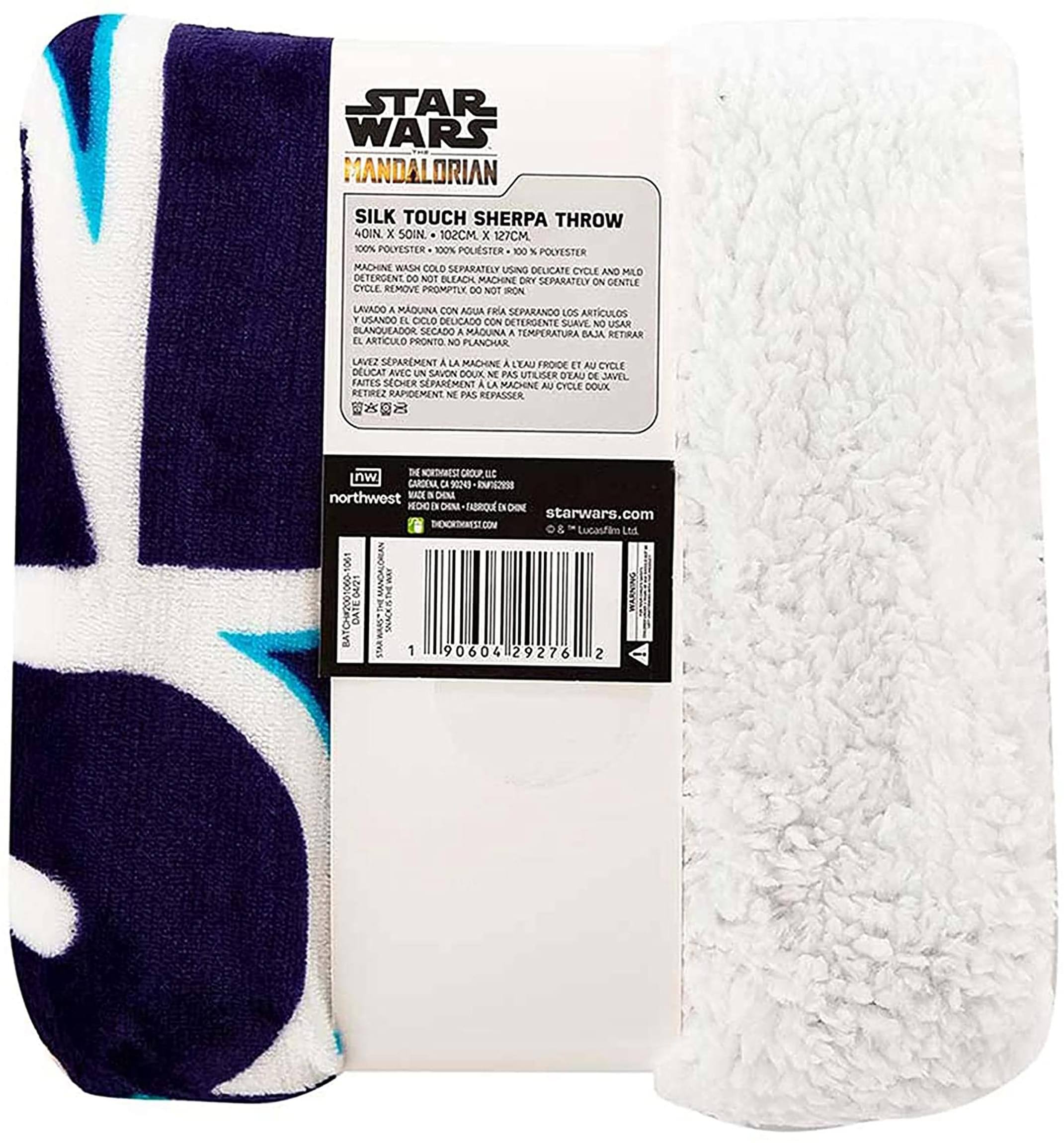 Sure, here is the corrected and grouped text from the image:

---

**STAR WARS MANDALORIAN**

**SILK TOUCH SHERPA THROW**

**40IN x 50IN**  
**102CM x 127CM**

**100% POLYESTER**

**CARE INSTRUCTIONS:**

- MACHINE WASH COLD SEPARATELY USING DELICATE CYCLE AND MILD DETERGENT.
- DO NOT BLEACH.
- MACHINE DRY ON LOW CYCLE.
- REMOVE PROMPTLY.
- DO NOT IRON.

**INSTRUCTIONS IN OTHER LANGUAGES:**

- **SPANISH:** LAVADO A MÁQUINA CON AGUA FRÍA SEPARANDO LOS ARTÍCULOS. NO USAR BLANQUEADOR. SECADO A MÁQUINA A TEMPERATURA BAJA. RETIRAR PRONTO. NO PLANCHAR.
- **FRENCH:** LAVEZ SÉPARÉMENT À LA MACHINE À L'EAU FROIDE ET AU CYCLE DELICAT AVEC UN DÉTERGENT DOUX. NE PAS UTILISER DE BLANCHISSEUR. FA