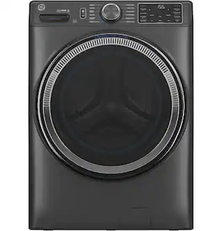 The image features a black washing machine with a large drum. The machine is designed with an Ultrafresh vent system, which ensures proper air circulation and helps maintain the freshness of the clothes being washed. The washing machine is also equipped with a timer, which allows users to set the desired washing time for their clothes. The machine is placed in a room with a white background, making it stand out prominently in the scene.