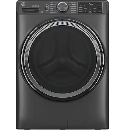 The image features a black washing machine with a large drum. The machine is designed with an Ultrafresh vent system, which ensures proper air circulation and helps maintain the freshness of the clothes being washed. The washing machine is also equipped with a timer, which allows users to set the desired washing time for their clothes. The machine is placed in a room with a white background, making it stand out prominently in the scene.