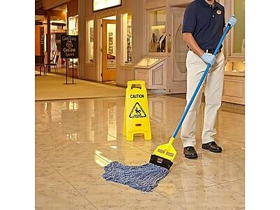 Certainly! Here is the corrected and grouped text from the image:

**Sign on the Floor:**
- CAUTION

**Sign in the Background:**
- Cartier
- 800
- Genuine
- Swiss

**Text on the Mop:**
- (No visible text)

**Text on the Sign:**
- (No visible text)