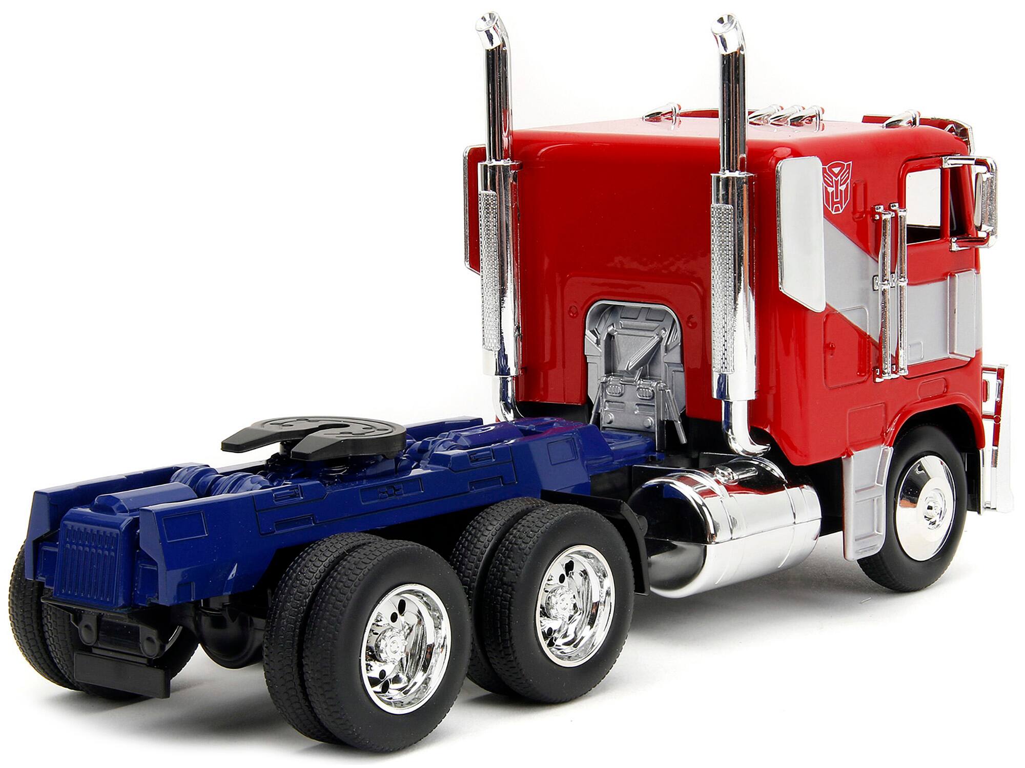 Left. Jada - Optimus Prime Tractor Truck Red & Blue Silver Stripes Transformers Rise of the Beasts 2023 Movie Hollywood Rides - Red And Blue With Silver.