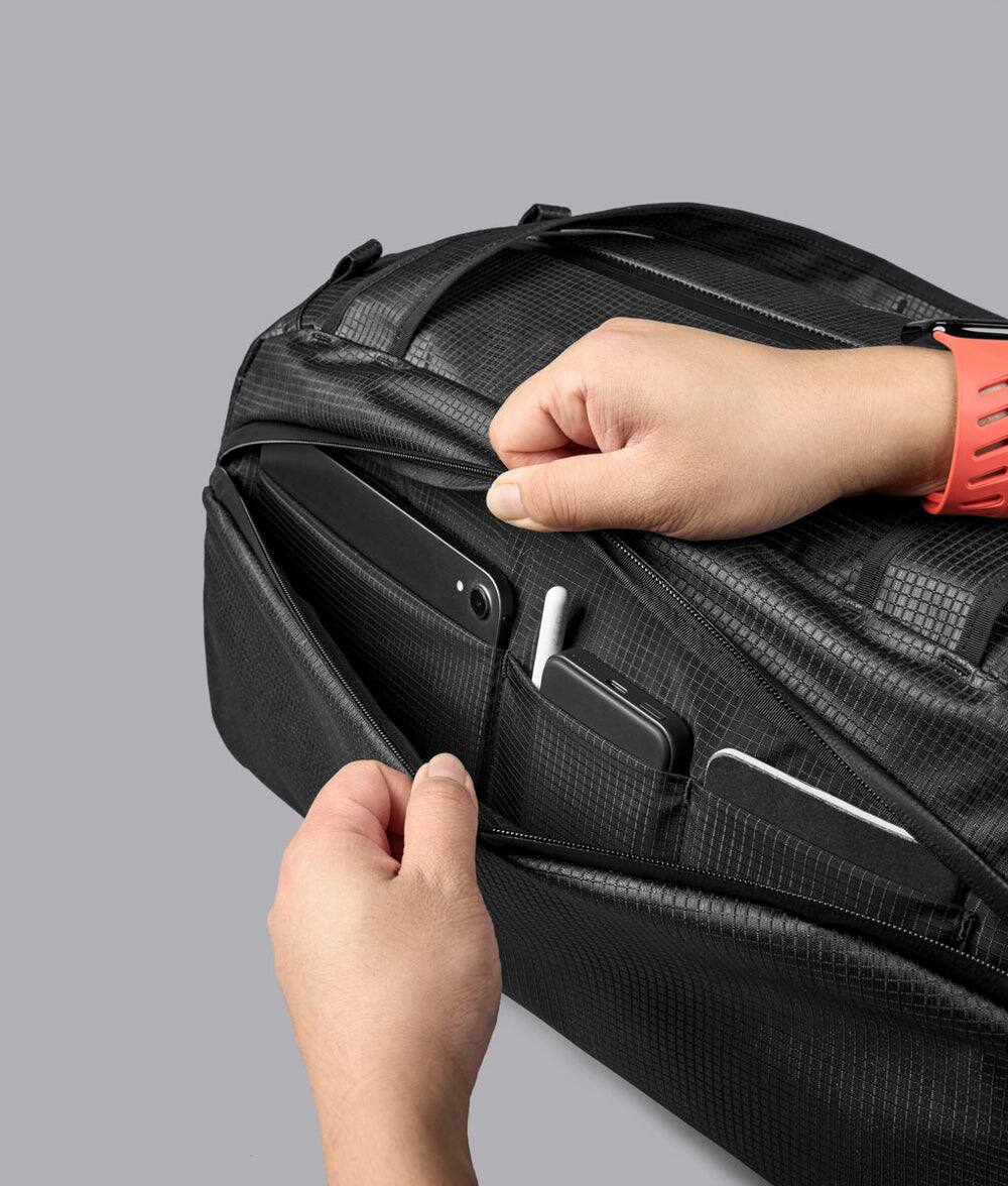 Alt View 6. ALPAKA - 35L Lightweight Duffel Bag for Gym, Weekend Trips & Carry-On Travel, Momentum Duffel, Weather-Resistant - Axodyne hybrid Black.