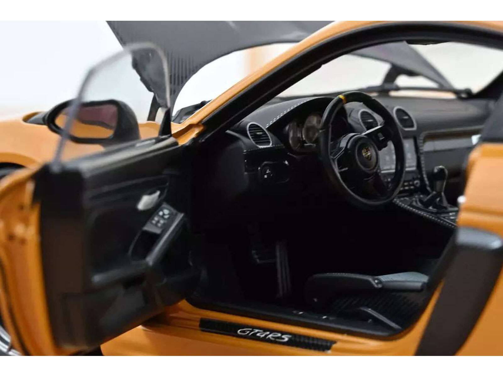 Back. Norev - 2023 Porsche Cayman GT4 RS Weissach Pack Bahama Yellow with Carbon Hood 1/18 Diecast Model Car by Norev - Yellow.