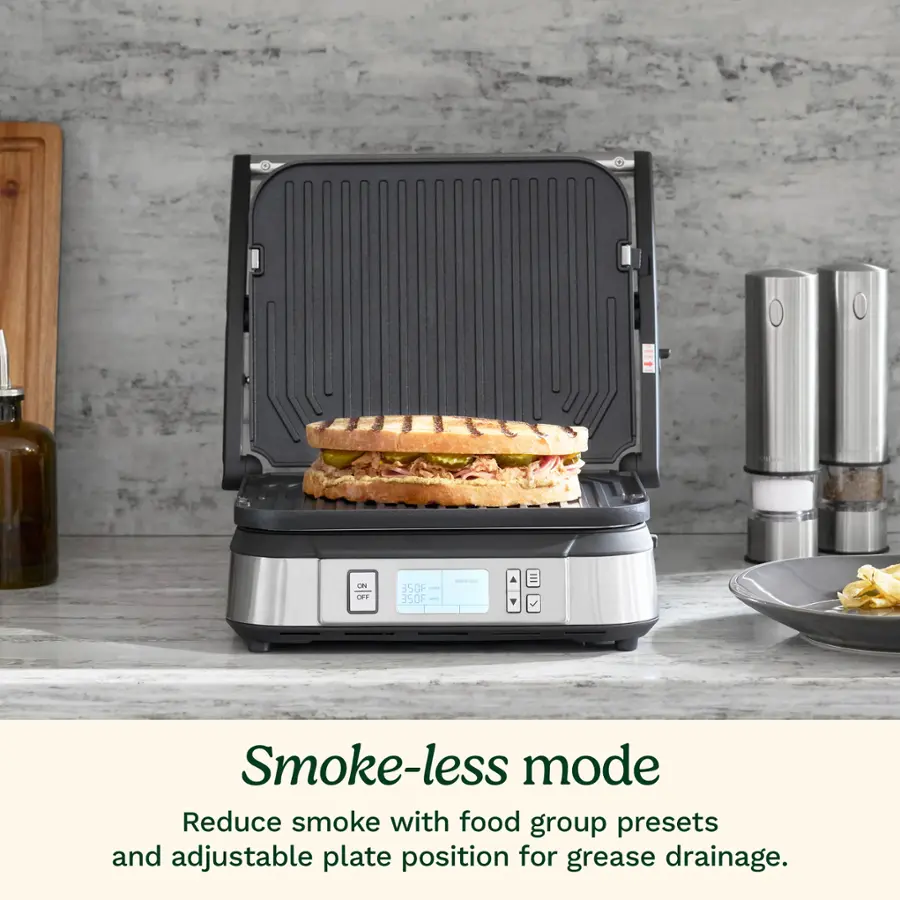 The text on the image reads: "Ces OEF 350F 350F I | Smoke-less mode Reduce smoke with food group presets and adjustable plate position for grease drainage."