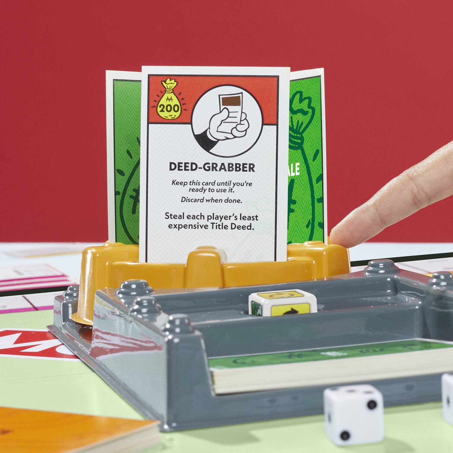 M 200 DEED-GRABBER Keep this card until you're ready to use it. Discard when done. Steal each player's least expensive Title Deed.