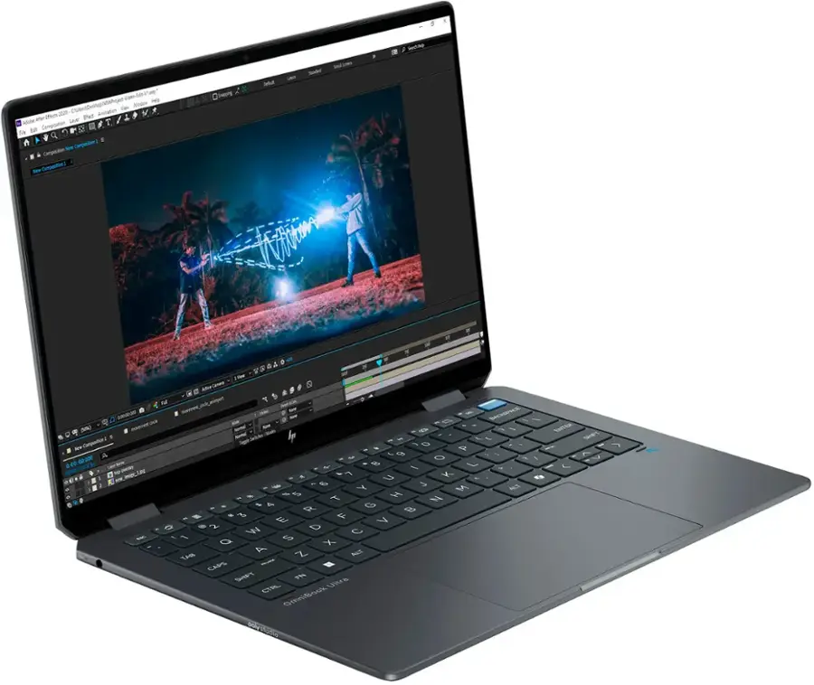 The image shows a laptop computer with a screen displaying a 3D animation. The laptop is open and ready for use. The screen is filled with a vibrant scene, possibly featuring a couple of people playing with a kite. The laptop is placed on a white background, which highlights the screen and the device itself.