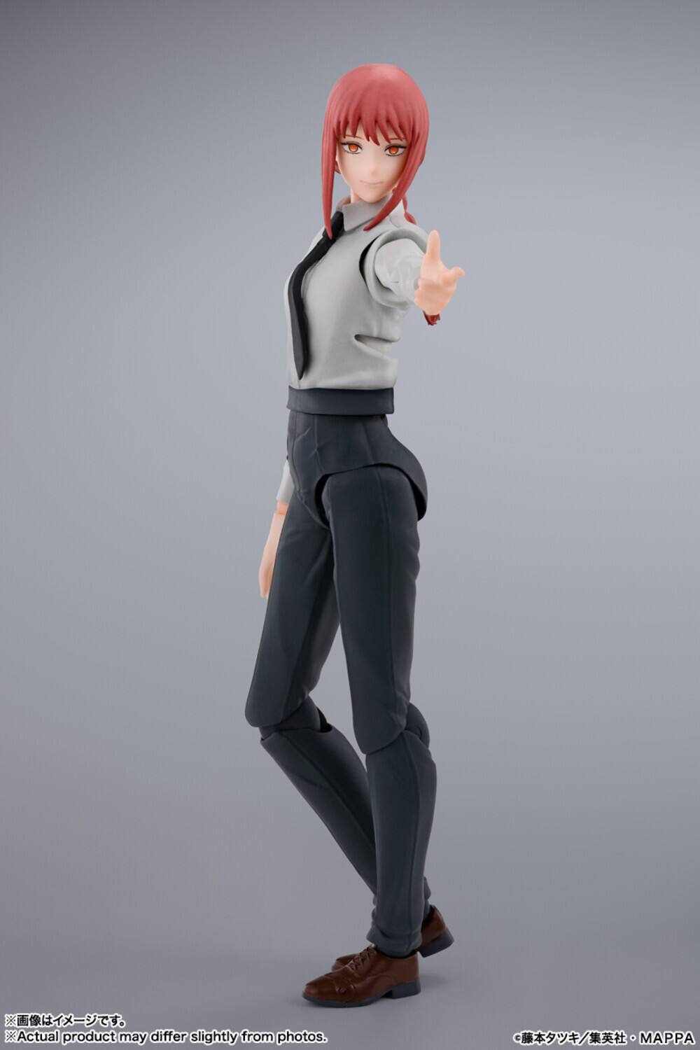 The text on the image reads:

"Actual product may differ slightly from photos.
画像はイメージです。
Actual product may differ slightly from photos."

Additionally, there is text in Japanese at the bottom right corner:

"©藤本タケシ／集英社・MAPPA"