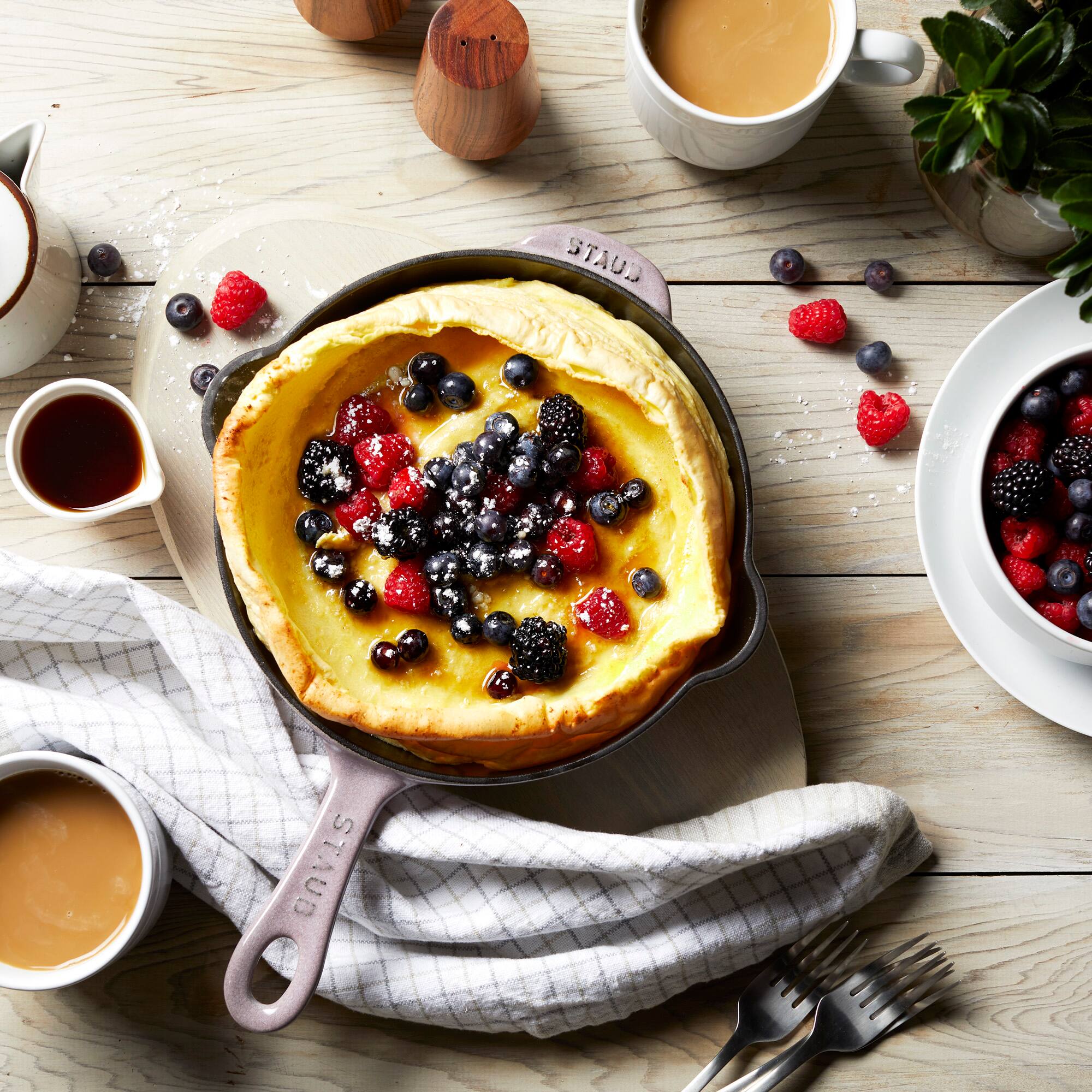 The text on the image reads:

- "STAUB" (on the pan handle and lid)
- "STAUB" (on the pan handle)