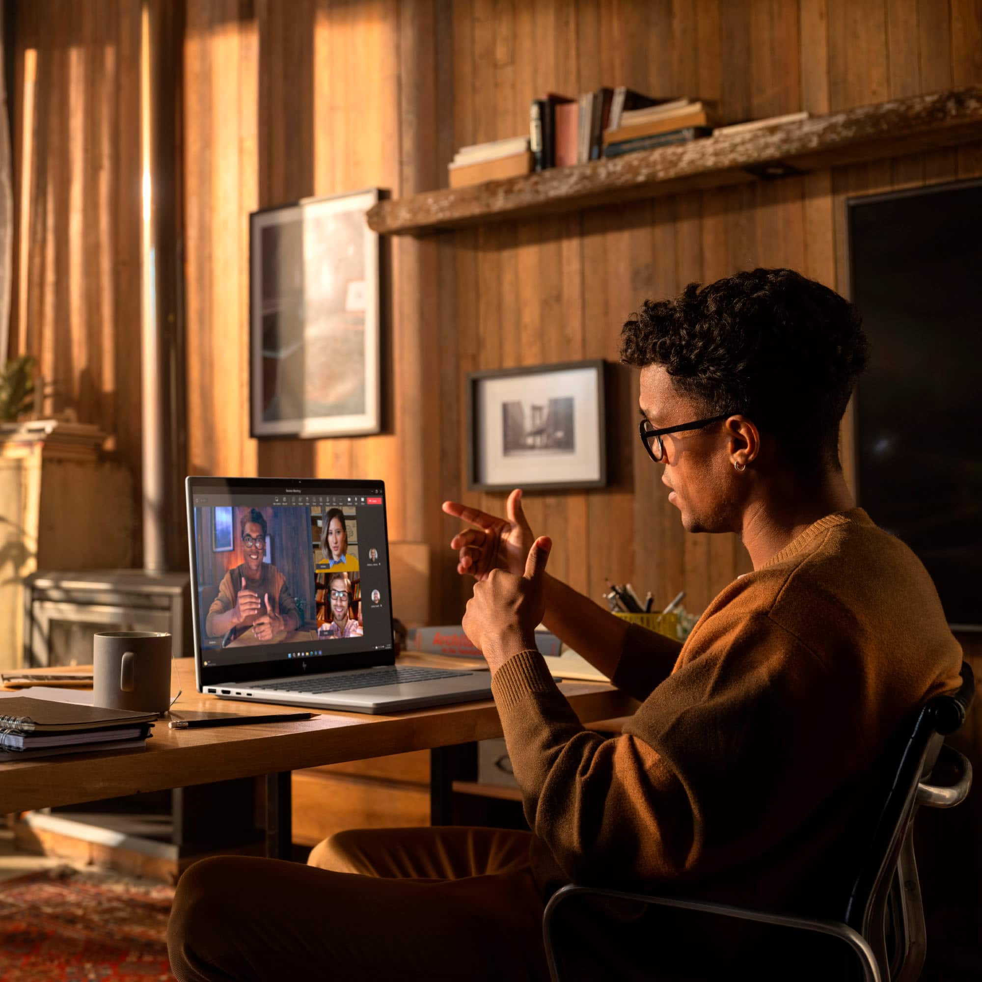 I'm sorry, but the image does not contain any text that can be grouped or corrected. The image shows a man sitting at a desk with a laptop, and there are no words or text visible in the image.