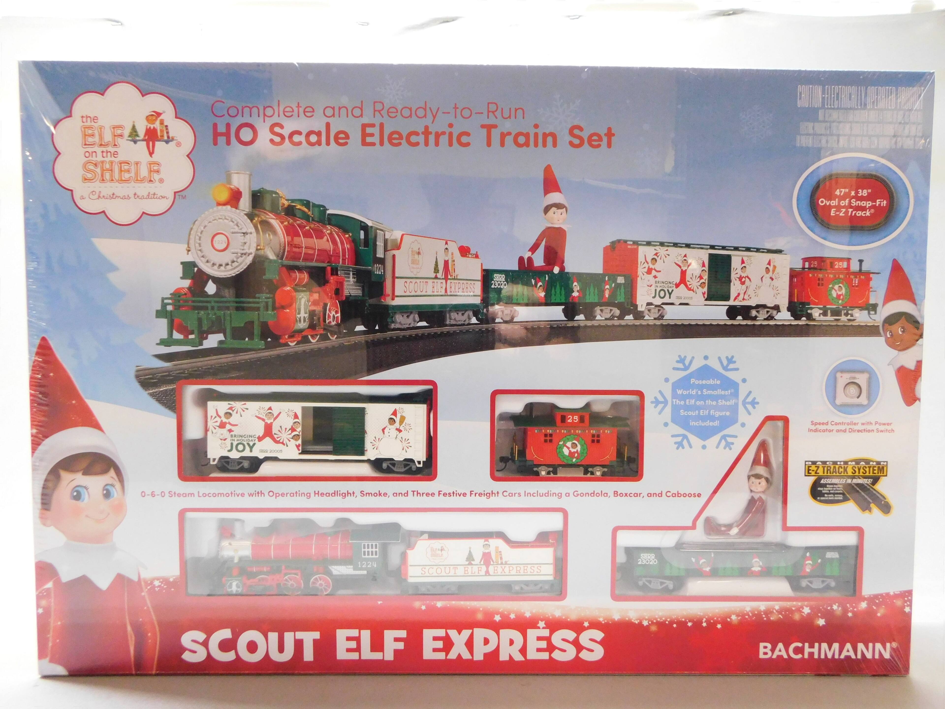 Complete and Ready-to-Run HO Scale Electric Train Set

the ELF on the SHELF
a Christmas tradition

47" x 38" Oval of Snap-Fit E-Z Track

0-6-0 Steam Locomotive with Operating Headlight, Smoke, and Three Festive Freight Cars Including a Gondola, Boxcar, and Caboose

Poseable World's Smallest "The Elf on the Shelf" Scout Elf Figure Included!

Speed Controller with Power Indicator and Direction Switch

E-Z TRACK SYSTEM

SCOUT ELF EXPRESS

BACHMANN