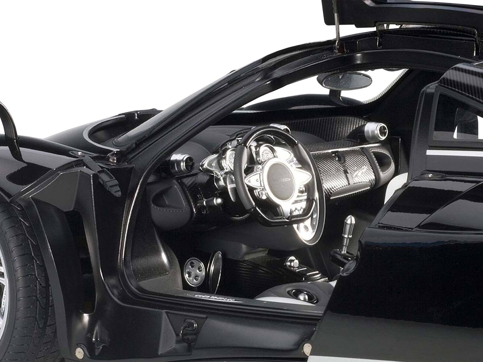 Left. Autoart - Pagani Huayra Gloss Black with Silver Stripes and Silver Wheels 1/12 Model Car by Autoart - Black with Silver Stripes.