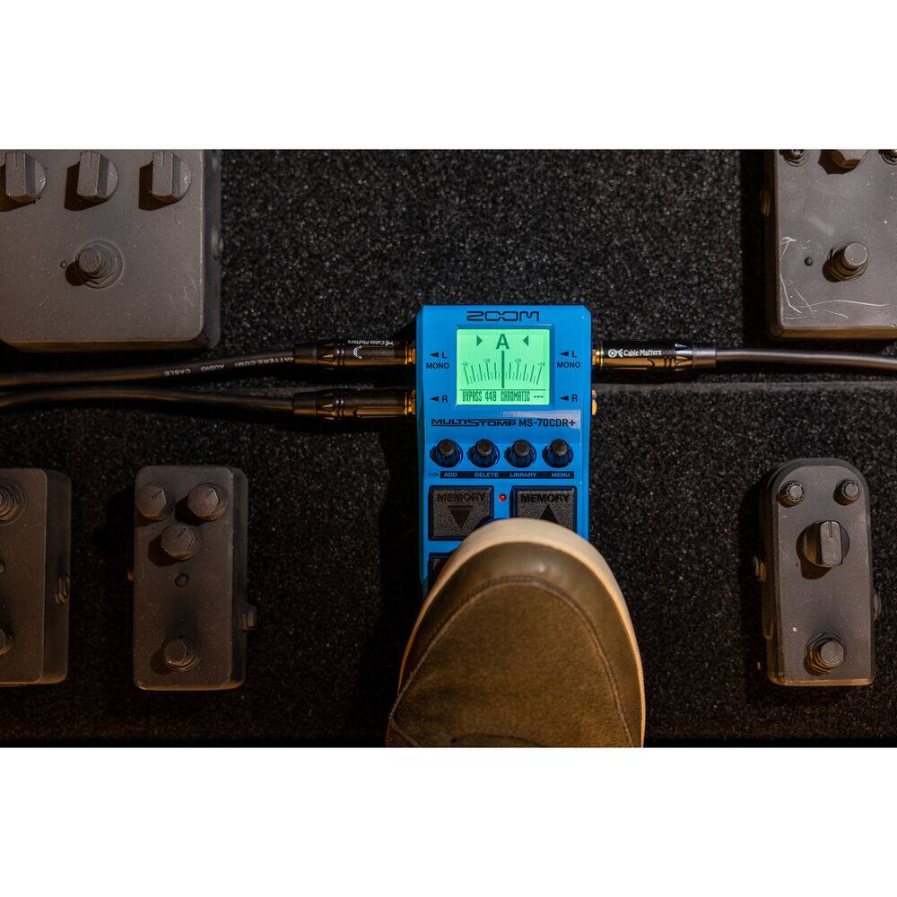 Sure, here is the corrected and grouped text from the image:

**Top Left:**
- CRATEUSLIO
- cetre evere

**Top Right:**
- MCOS A L L MONO MONO UTA TT A RPEES E C I PR0
- CaltMaters
- C bat MMLTIST ORE MS MS-70COR
- CLEN oe
- MEMORY MEMORY

**Bottom Center (on the pedal):**
- ZOOM
- A
- MONO
- DIVIDES 44.4 CHANNELS
- MULTISTOMP MS-70CDR+
- ©Cable Partner
- L
- R
- MEMORY
- DELETE
- LIBRARY
- MENU
- MEMORY