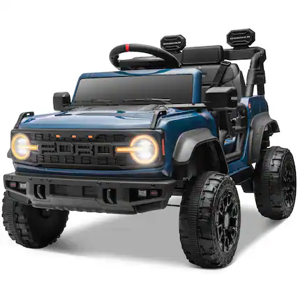 The image shows a blue toy off-road vehicle with black tires and a black roll cage. The vehicle has a prominent front grille with the word "BRONCO" written on it. The headlights are illuminated, and there are additional lights mounted on the roof. The tires have the text "AT TERRAIN" on them.