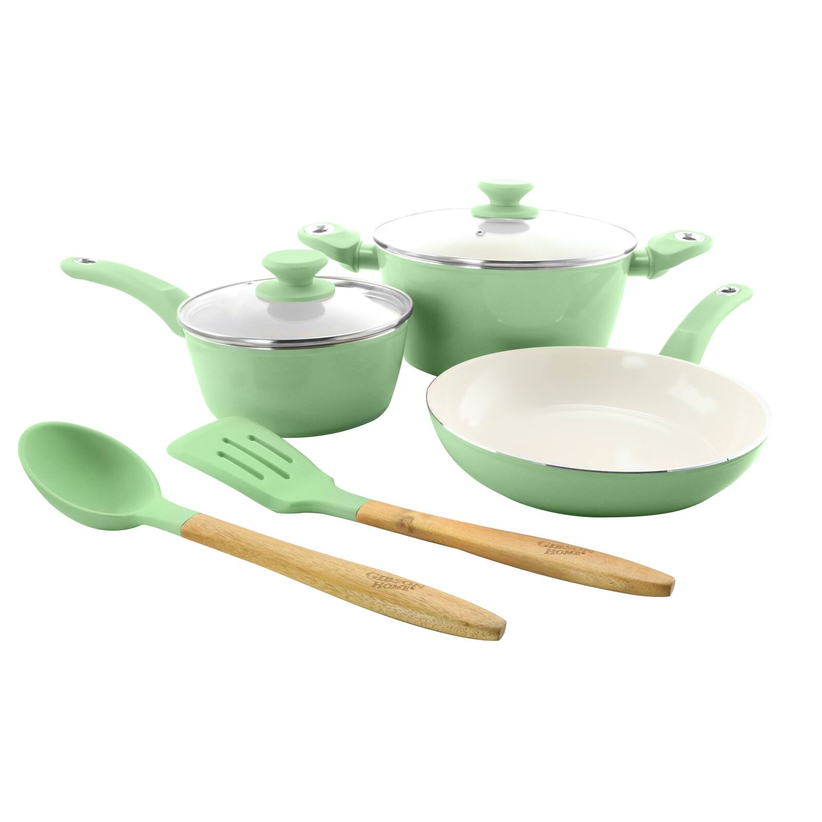 The image features a set of green cookware, including a pot, a pan, and a spoon. The pot is placed next to the pan, and the spoon is positioned near the pot. The cookware is made of a light green material, giving it a unique and appealing appearance. The arrangement of the cookware suggests that it is ready for use in preparing a meal.