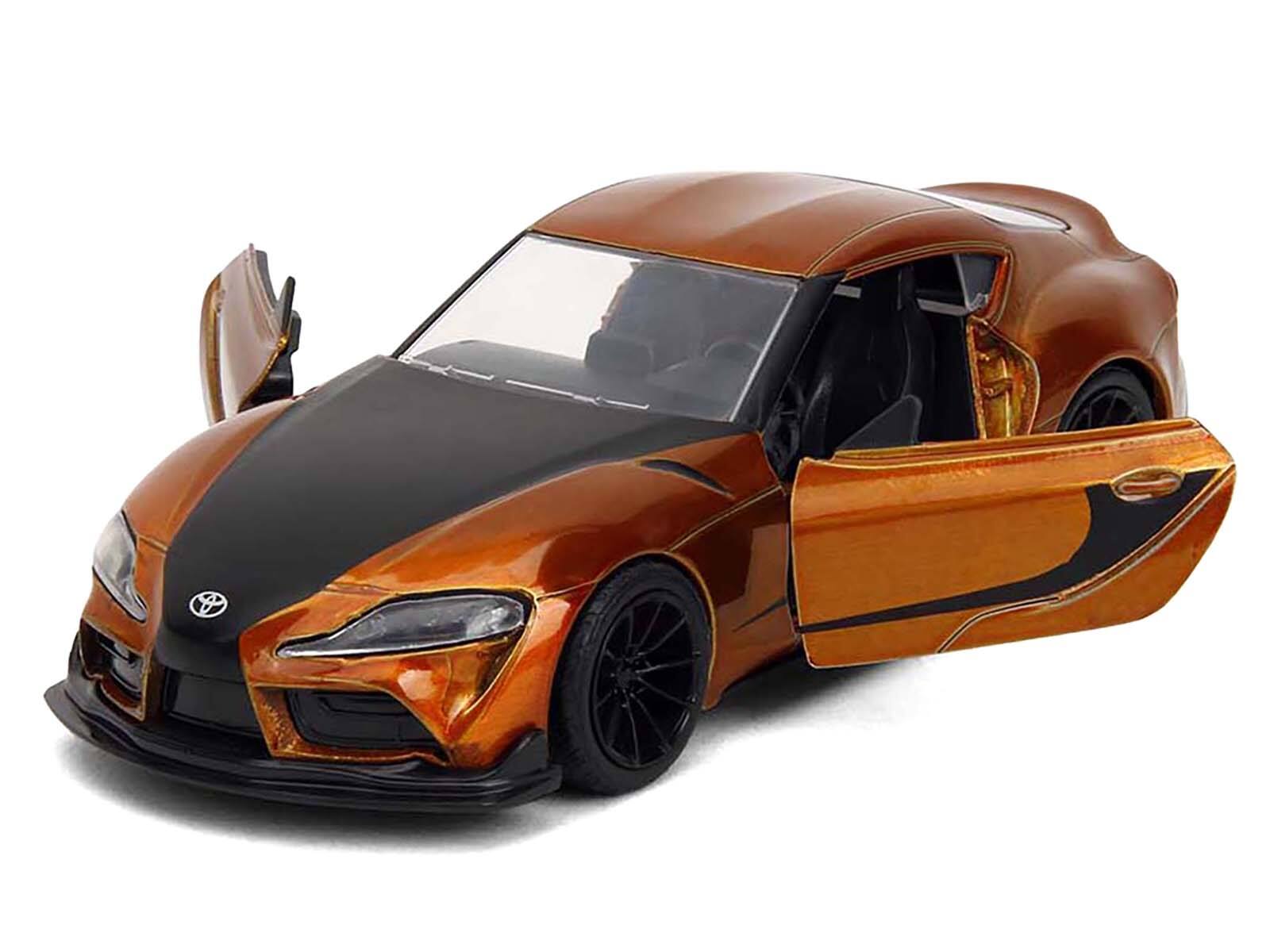 Angle. Jada - 2020 Toyota Supra Orange Metallic with Black Stripes "F9" (2021) Movie "Fast & Furious" Series 1/32 - Orange Metallic And Black.