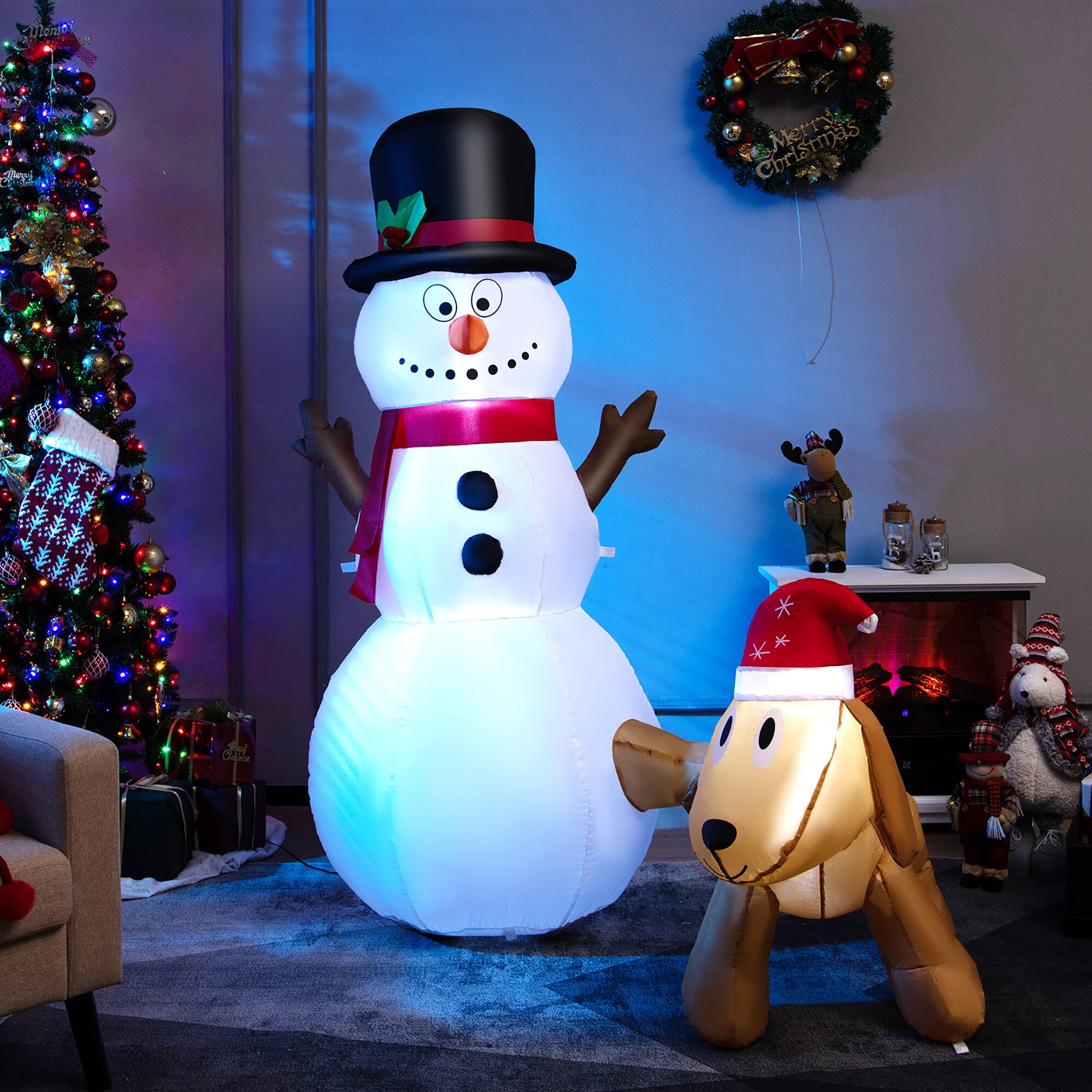 "Snowman and dog inflatable decorations for Christmas. A large inflatable snowman with a red scarf and a small inflatable dog with a Santa hat."