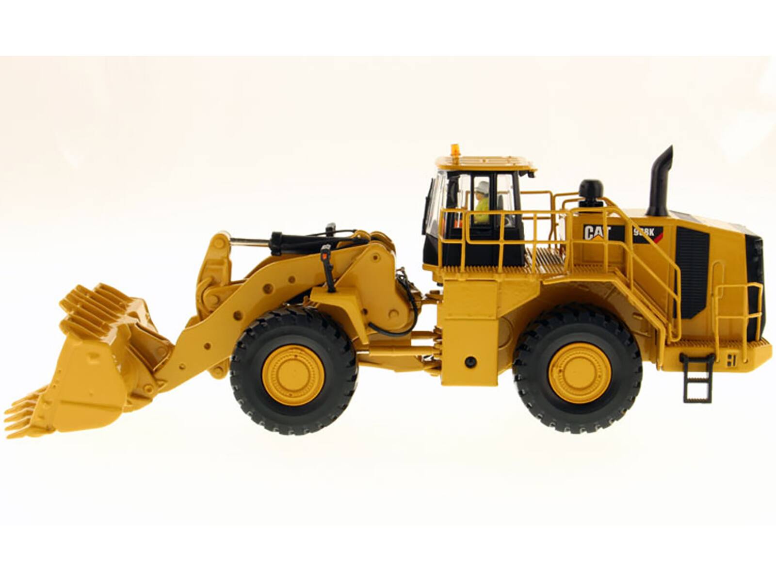 Left. Diecast Masters - CAT Caterpillar 988K Wheel Loader with Operator "High Line Series" 1/50 Diecast Model by Diecast Masters - Yellow .