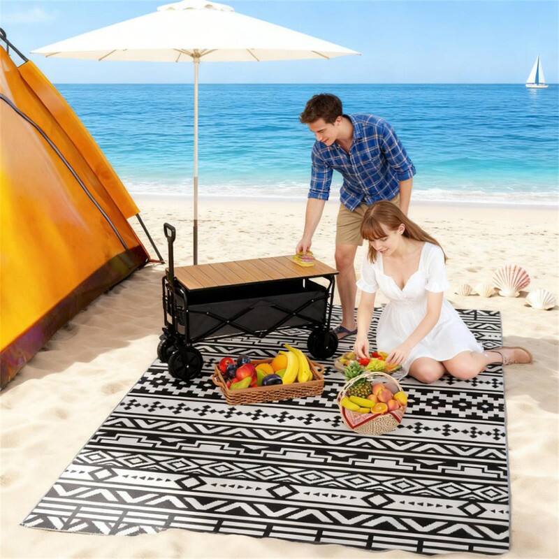 Angle. HTUTWOO - 6' x 9' Outdoor Reversible Rug - Waterproof Plastic Straw Patio Mat with Carry Bag, Foldable Camping Carpet, - Black White.