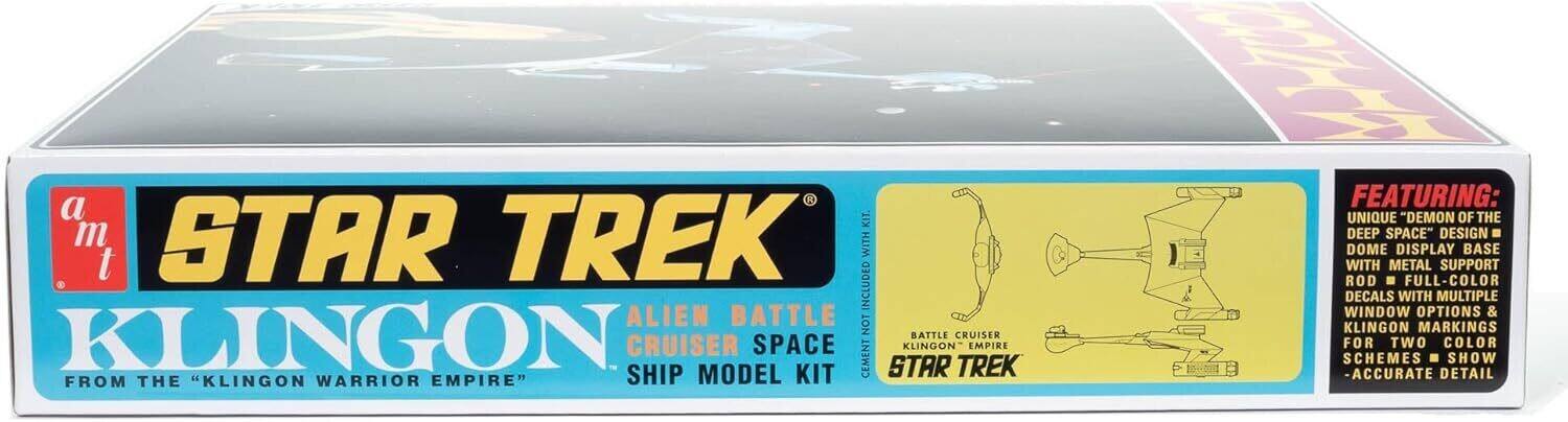 A Star Trek Alien Battle Cruiser Space Ship Model Kit from the "Klingon Warrior Empire" featuring a unique "Demon of the Deep Space" design. Dome display base with metal support rod. Full-color decals with multiple window options & Klingon markings for two color schemes. Show accurate detail.