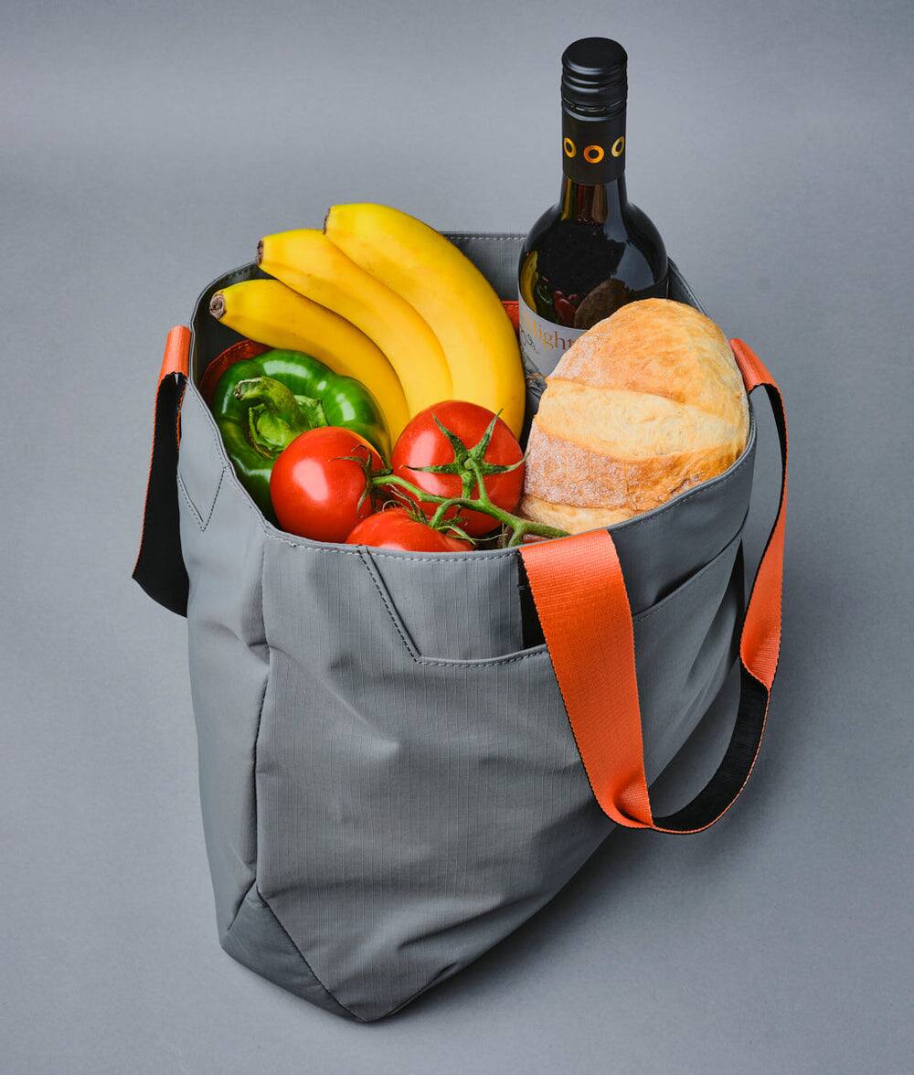 Alt View 4. ALPAKA - Elements Tote Bag 14.5L Weatherproof Foldable Travel Tote with Magnetic Closure - Grey Axoflux 210D.