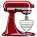 The text on the image reads: "Mix w/ 325 KitchenAid. - - - 0 Stir 2 4 6 8 10 ARTISAN KitchenAid." This text is likely meant to provide instructions for using the red mixer, which is a KitchenAid brand. The instructions indicate that the mixer should be used with 325 KitchenAid and that the user should stir the contents at various intervals, such as 2, 4, 6, 8, and 10 seconds. The mixer is designed to be an artisan kitchen appliance, which suggests that it is intended for professional or high-quality culinary use.