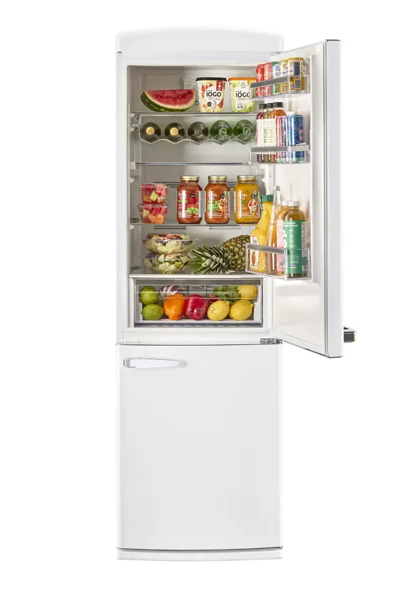 The refrigerator is stocked with various food items, including fruits, vegetables, and drinks. There are apples, oranges, and bananas in the fridge, as well as multiple bottles of juice and water. The refrigerator is well-organized, with the food items placed neatly in their respective compartments. The variety of items suggests that the refrigerator is well-stocked and ready for use.