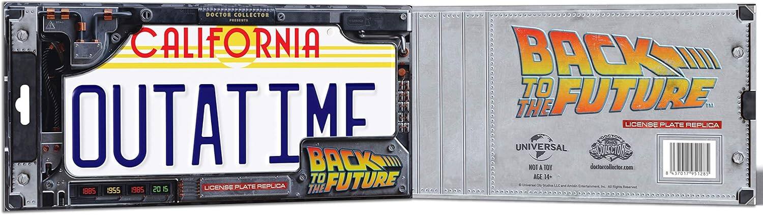 The text on the image reads:

"California Outatime Back to the Future License Plate Replica. Doctor Collector Presente. Collector's Back to the Future. The Outatime. Licensed by Universal Collectors. Not a toy. For ages 14+. 1955-1985-2015. The Future. Universal Studios Licensors. Back to the Future. DoctorCollector.com. 837017951285. To a age 14+. 18B5 1955 1985 2015. The Future. Universal Studios Licensors. Back to the Future. DoctorCollector.com. 837017951285. To a age 14+. 18B5 1955 1985 2015. The Future. Universal Studios Licensors. Back to the Future. DoctorCollector.com. 837017951285. To a age 14+. 18B5 1955 1985 2015. The Future. Universal Studios Licensors. Back to the Future. DoctorCollector.com. 837017951285. To a age 14+. 18B5 1955 1985 2015. The Future. Universal Studios Licensors. Back to the Future. DoctorCollector.com. 837017951285. To a age 14+. 18B5 1955 1985 2015. The Future. Universal Studios Licensors. Back to the Future. DoctorCollector.com. 837017951285. To a age 14+. 18B5 1955 1985 2015. The Future. Universal Studios Licensors. Back to the Future. DoctorCollector.com. 837017951285. To a age 14+. 18B5 1955 