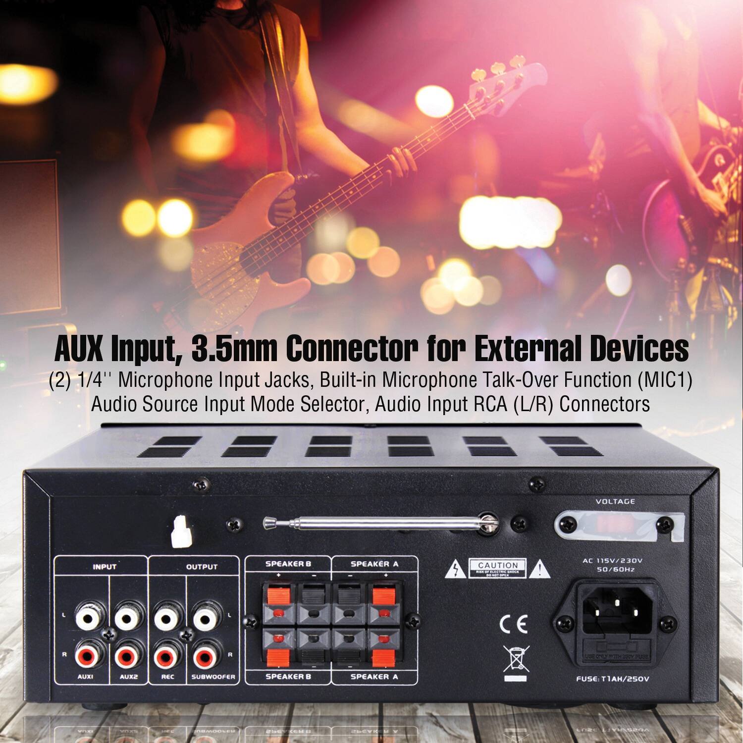 The image features a black box with a row of knobs on the front, which is an audio device with various input and output options. The device has a 3.5mm connector for external devices, two 1/4" microphone input jacks, and a built-in microphone talk-over function (MIC1). Additionally, it has an audio source input mode selector and audio input RCA (L/R) connectors. The device is designed to handle voltage input and output, and it is suitable for use with speakers and subwoofers.