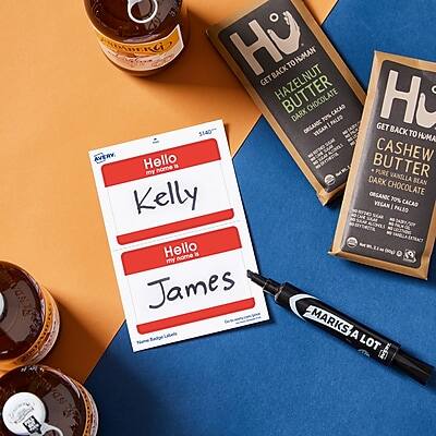 Sure, here is the corrected and grouped text:

---

**Product Labels:**
- GET BACK TO HOMAN
  - HAZELNUT BUTTER
  - DARK CHOCOLATE
  - ORGANIC
  - VEGAN
  - 10% PALEO CACAO

- GET BACK TO HOMAN
  - CASHEW BUTTER
  - DARK CHOCOLATE
  - ORGANIC
  - VEGAN
  - 70% PALEO CACAO

**Name Tags:**
- Hello my name is Kelly
- Hello my name is James

**Additional Text:**
- MARKISA LOT

---

This should reflect the text from the image accurately.