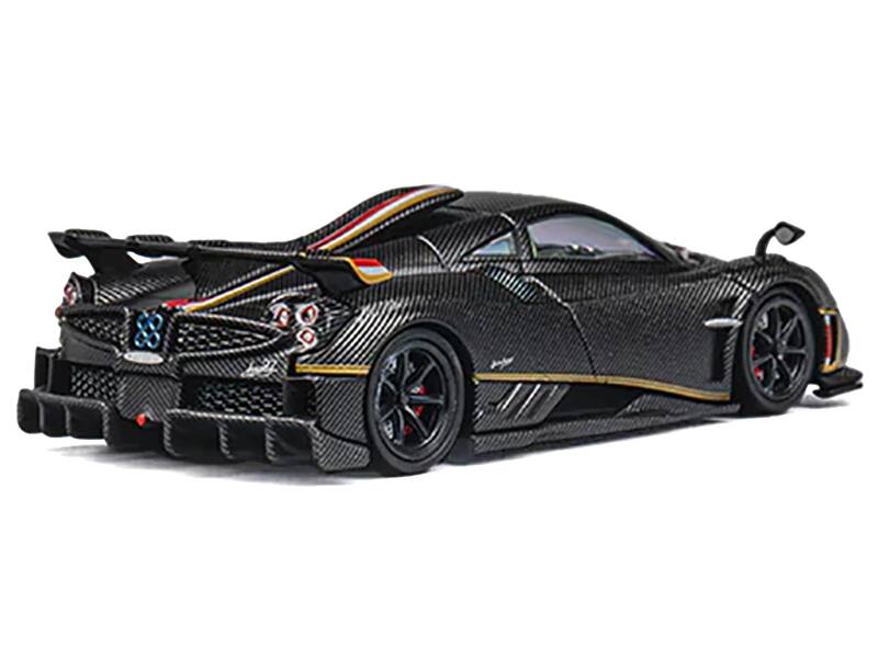 Left. CM Models - Pagani Imola Black Carbon with Red and Gold Stripes with Extra Wheels 1/64 Diecast Model Car by CM Model - Black.
