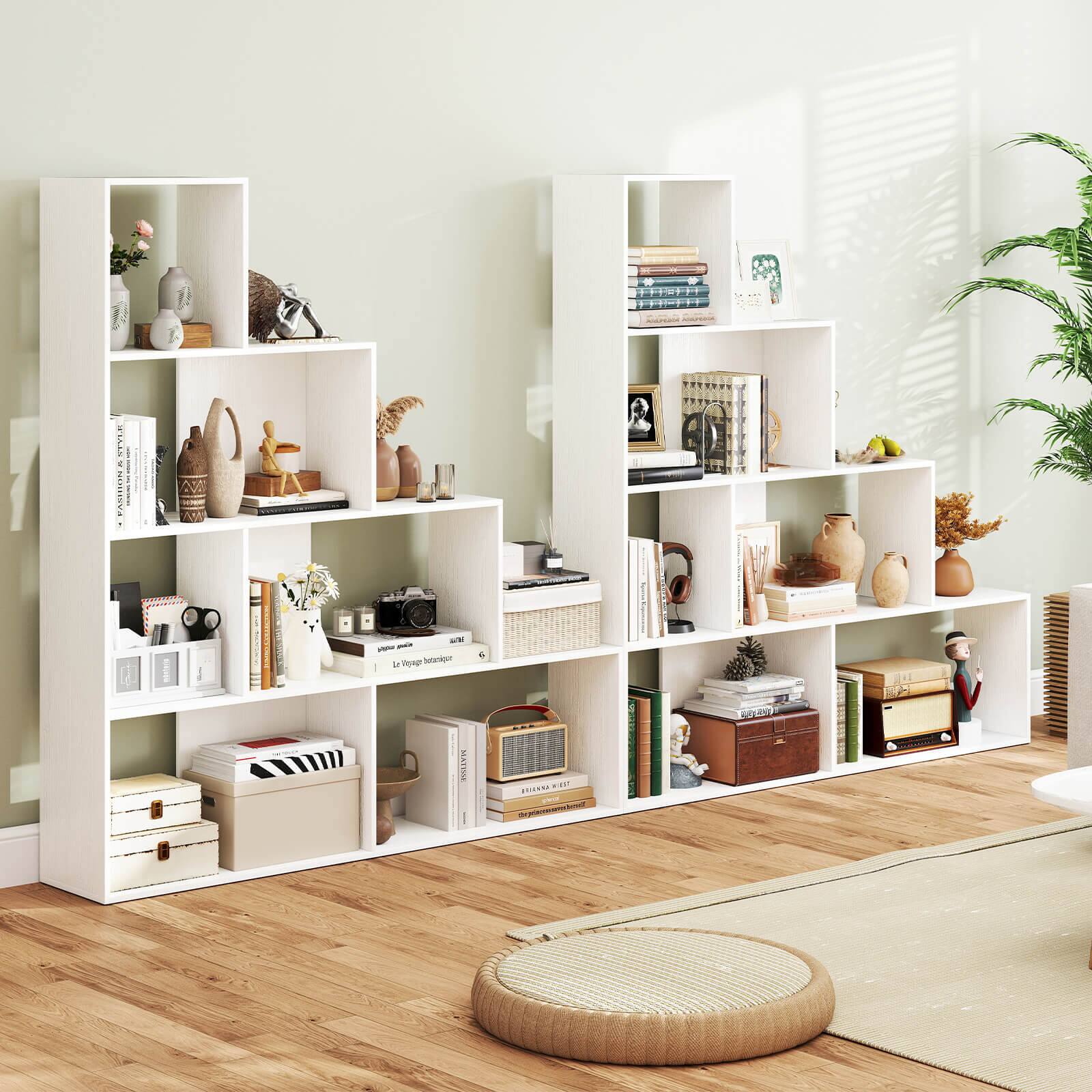 The image shows a living room with a bookshelf filled with various items, including books, vases, and a potted plant. The bookshelf is located next to a window, and there is a rug on the floor. The room also features a couch and a chair, creating a cozy and comfortable atmosphere.