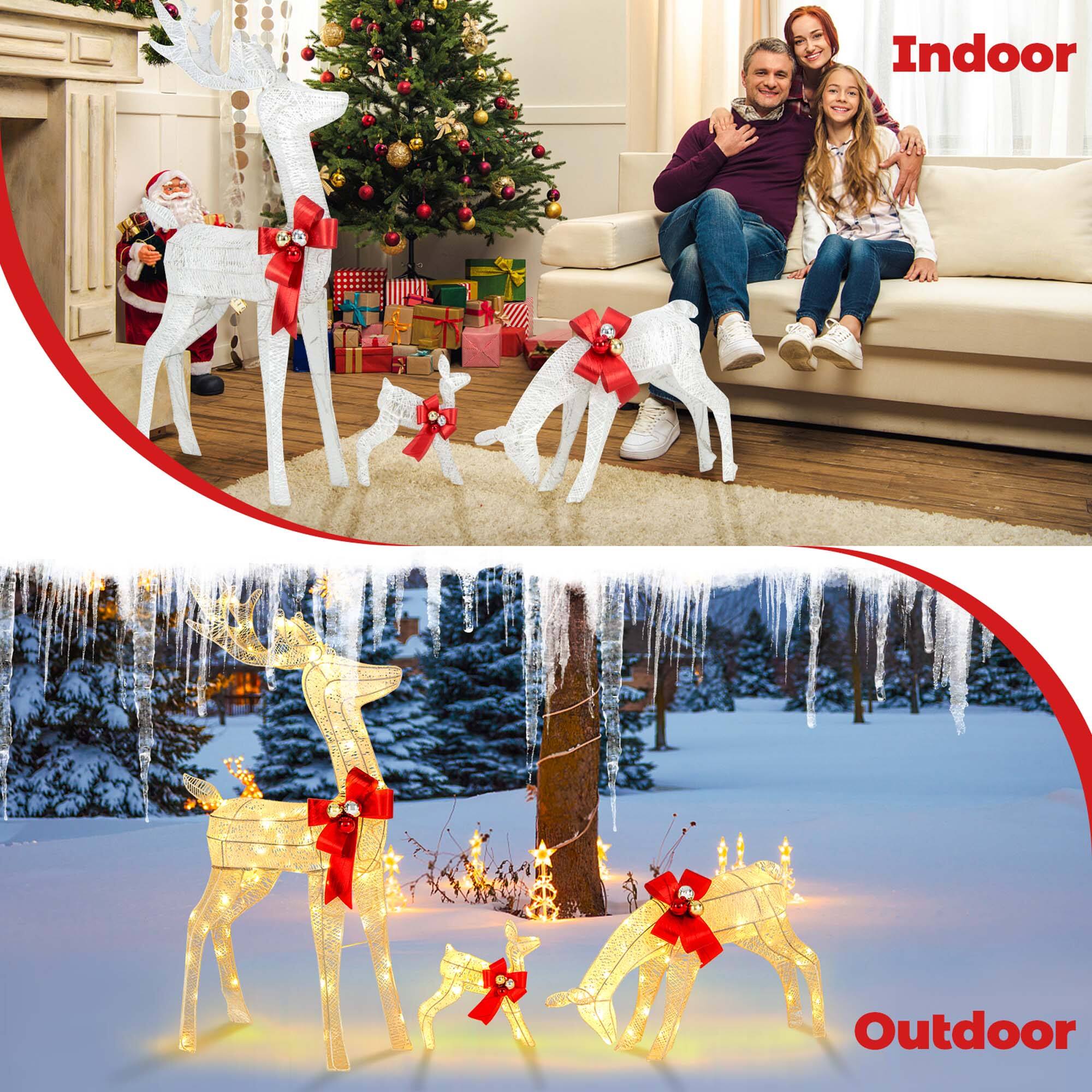 Indoor:
A man and a little girl are sitting on a couch next to a Christmas tree. They are surrounded by fake reindeer figurines, which are placed on the floor and the couch. The scene appears to be a cozy and festive indoor setting.

Outdoor:
A snowy scene with a group of deer figurines is displayed. The deer are scattered around the area, some on the ground and others on the snow. The outdoor setting creates a wintry atmosphere, perfect for the holiday season.