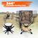 The image features a 360° rotatable hunting chair with a camouflage pattern. The chair is designed for hunting enthusiasts and offers a comfortable and stable seating option while in the field. The chair is equipped with a rotating base, allowing hunters to easily change their viewing angle and observe their surroundings from multiple angles. The chair is also accompanied by a foldable table, providing a convenient surface for placing items like a laptop or a cup. The combination of the chair and table creates a versatile and practical setup for hunters to enjoy their time in the field.