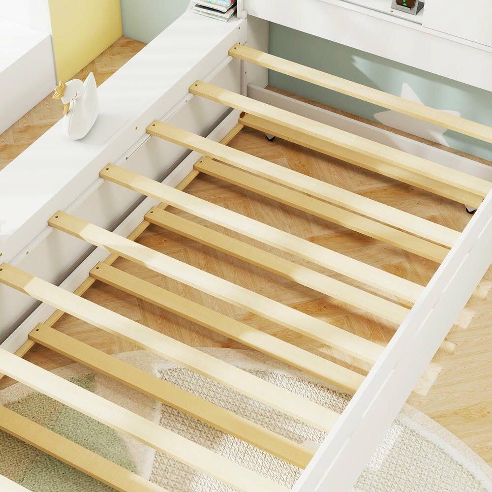 Left. Kadyn - Twin Bed Frame with Built-In Trundle and Convenient Power Outlets, Space-Saving Design with USB Charging Ports - White.