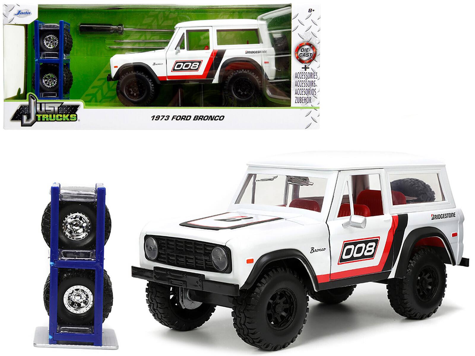 "1973 Ford Bronco #008 White w/Red and Black & Red Interior w/ Extra Wheels ""Just Trucks"" 1/24 Diecast Model Car by Jada" price history on PriceWatchPro
