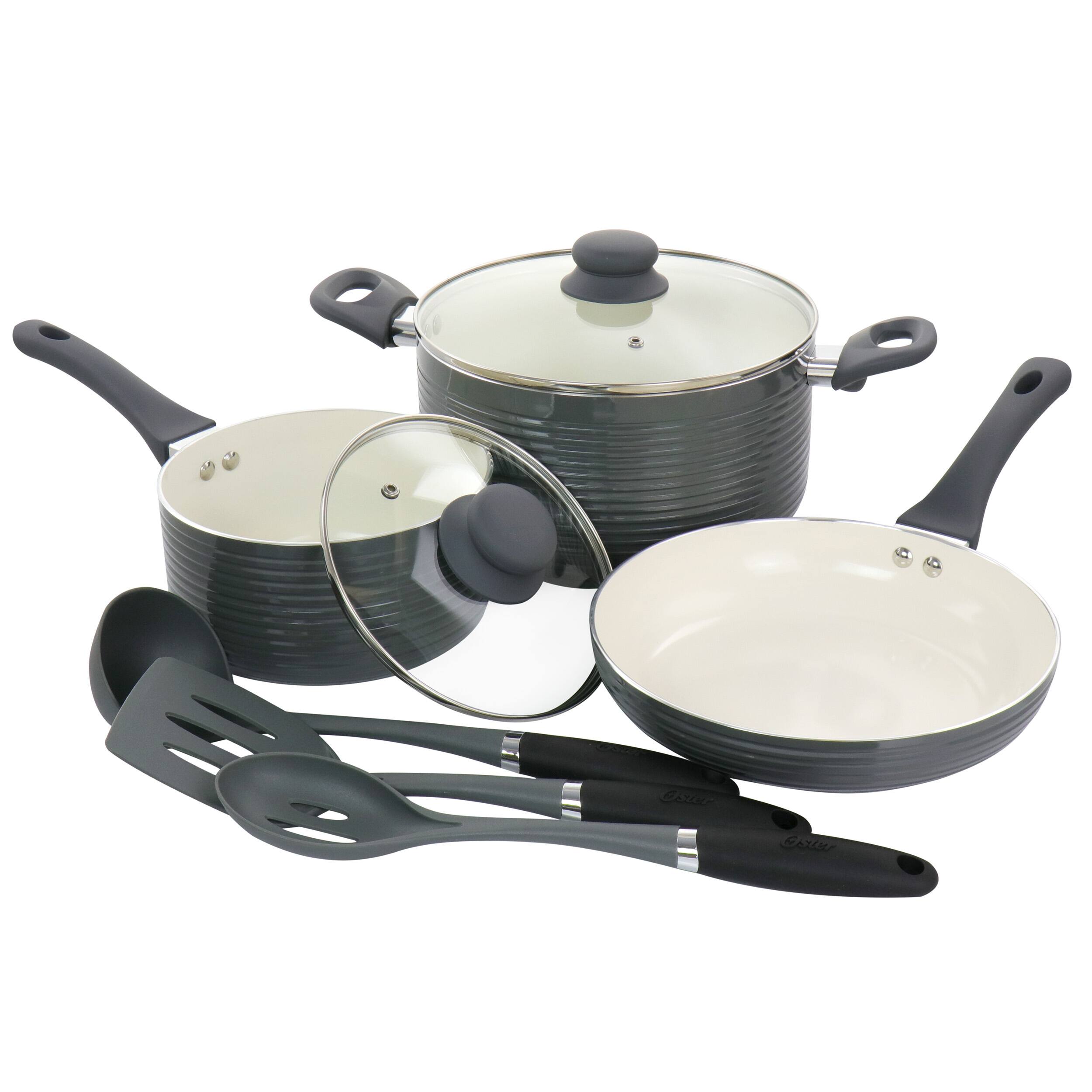 The image shows a set of cooking utensils, including a large pot, a frying pan, and a spoon. The pot is placed on top of the frying pan, and the spoon is positioned next to the frying pan. The cooking utensils are arranged in a way that they can be easily used for preparing meals.