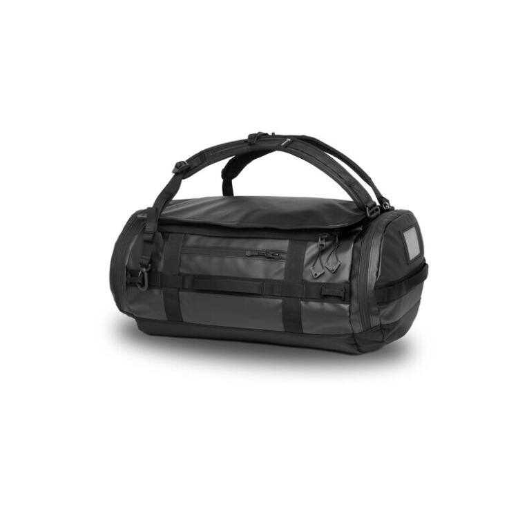 Left. WANDRD - WANDRD CARRYALL Duffel Backpack with Expandable Bottom Compartment (Black, 60L) - Black.