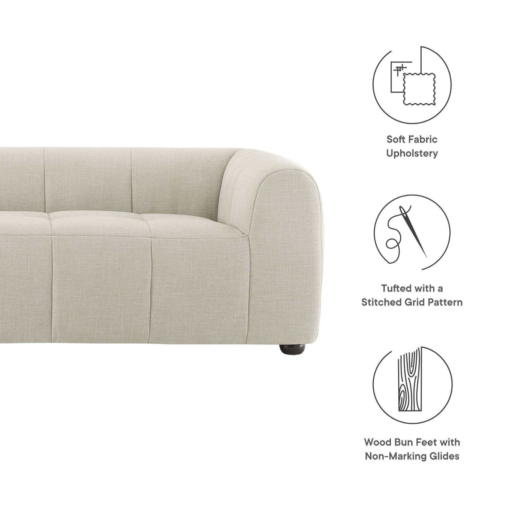 - Soft Fabric Upholstery
- Tufted with a Stitched Grid Pattern
- Wood Bun Feet with Non-Marking Glides