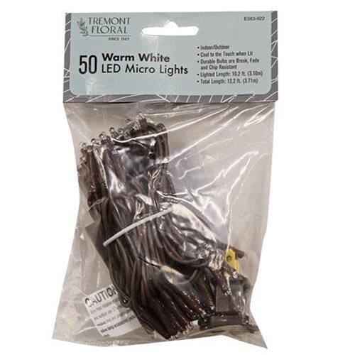 TREMONT FLORAL  
ES63-922  
Warm White  
50 LED Micro Lights  
Cool to the Touch when Lit  
Durable Bulbs are Break Fade  
Lighted Length: 122" (3.10m)  
Total Length: 122.6" (3.71m)  
CAUTION