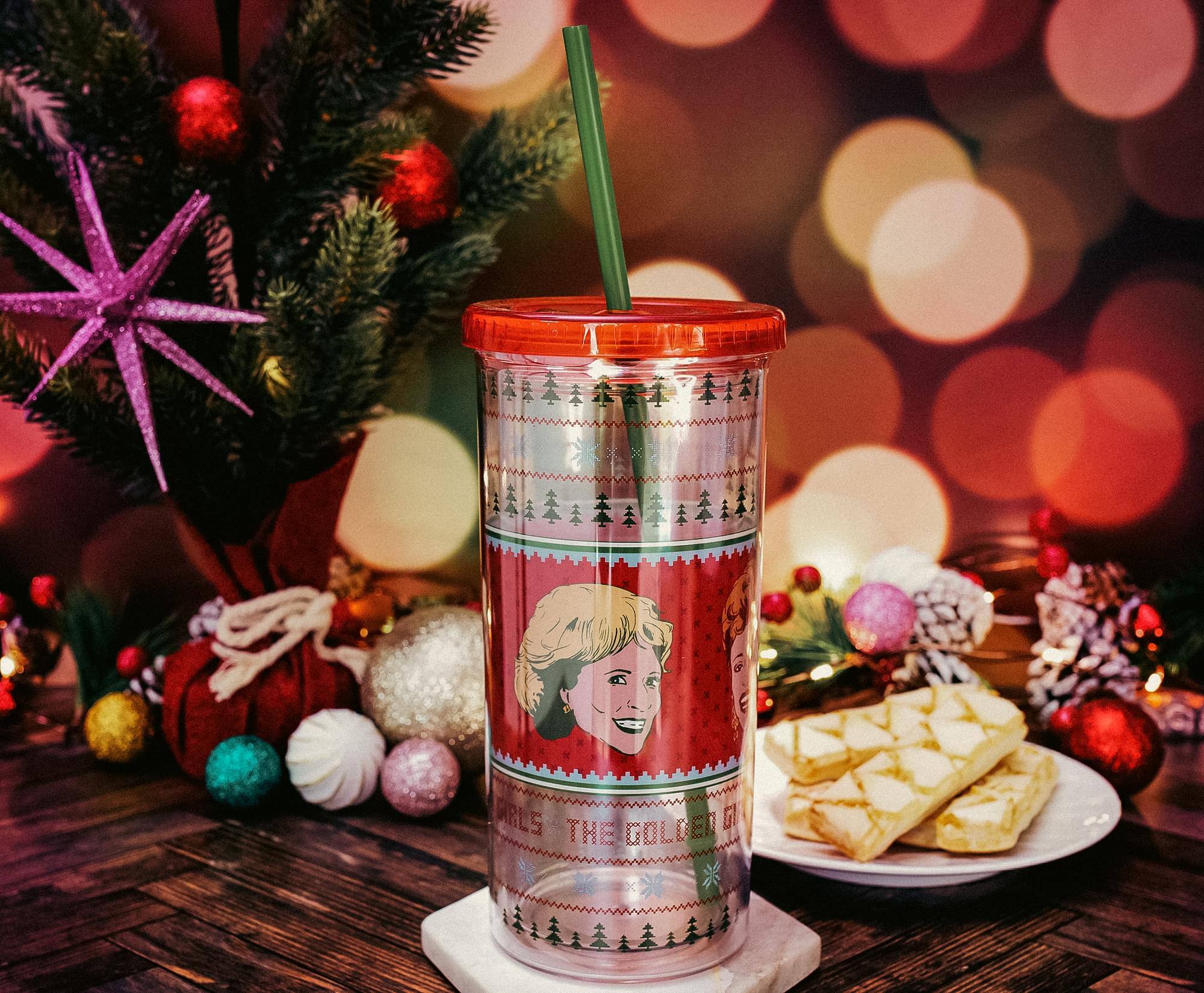 Sure, here is the corrected and grouped text from the image:

---

**CURLS GOLDEN GIRL**

---

The text is part of a festive design on a cup, featuring a holiday theme with Christmas trees and a smiling woman's face.
