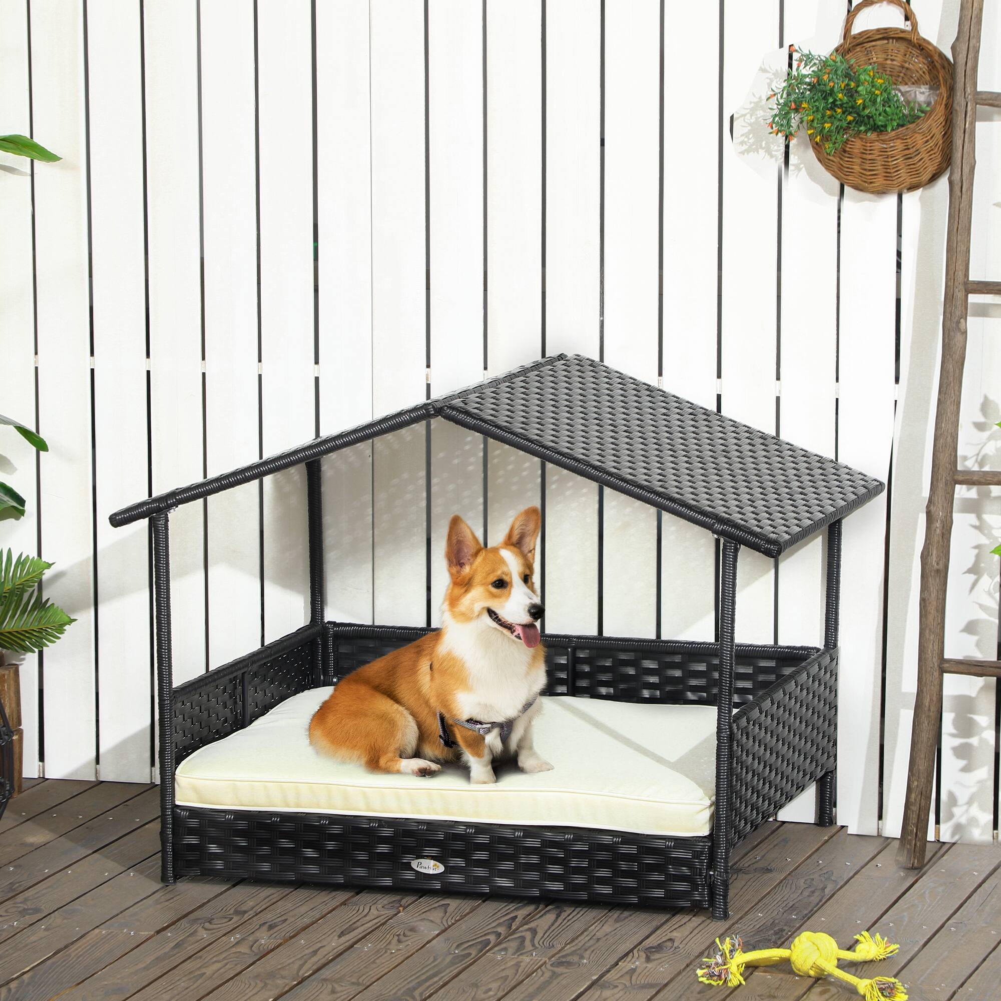 Angle. Siljoy - PE Rattan Dog House with Canopy, Water‑Resistant Cushion & Elevated Base for Small/Medium Dogs.
