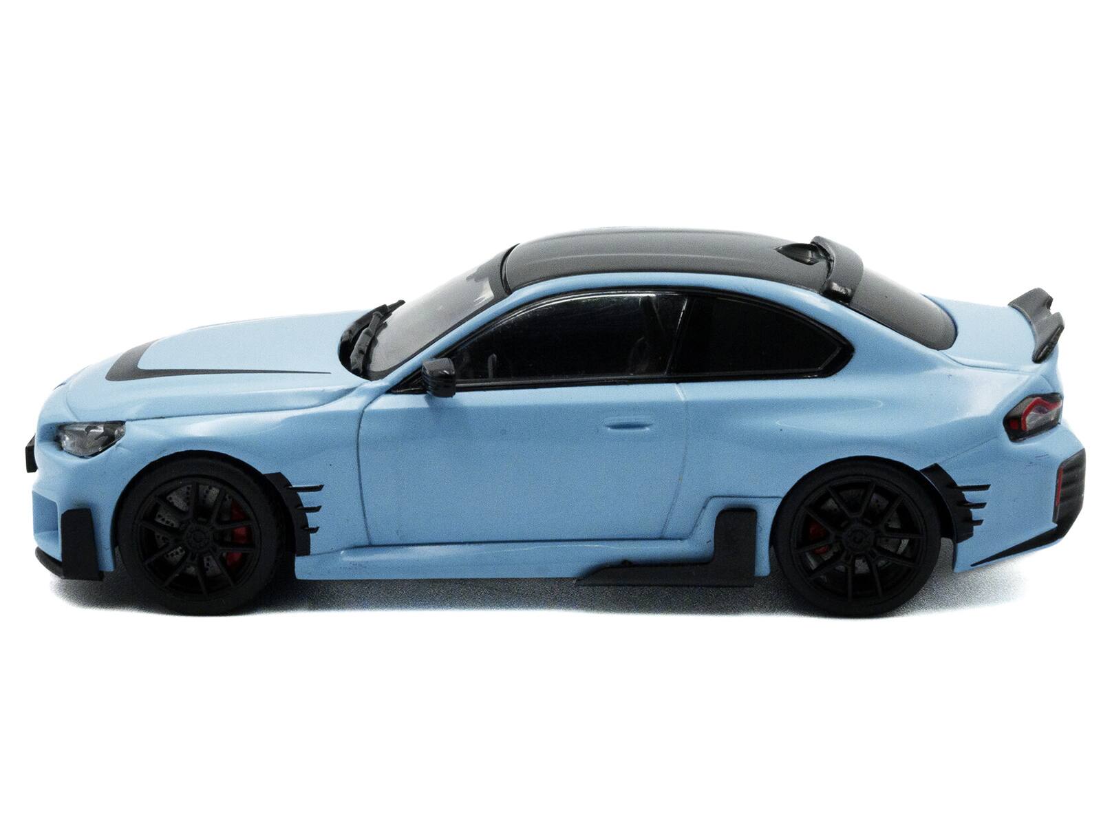 Angle. Solido - 2023 BMW M2 M Performance Zandvoort Blue with Black Top 1/43 Diecast Model Car by Solido - Blue with Black.