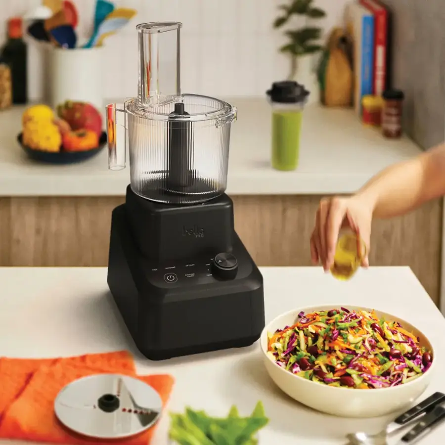 Bella FRO is a blender that is being used to make a salad.