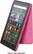 The image features a pink tablet with a screen displaying various apps, including Amazon Kids, Netflix, and Spotify. The tablet is propped up on a pink stand, which is also being advertised as a separate device. The text on the image reads, "Device sold separately."