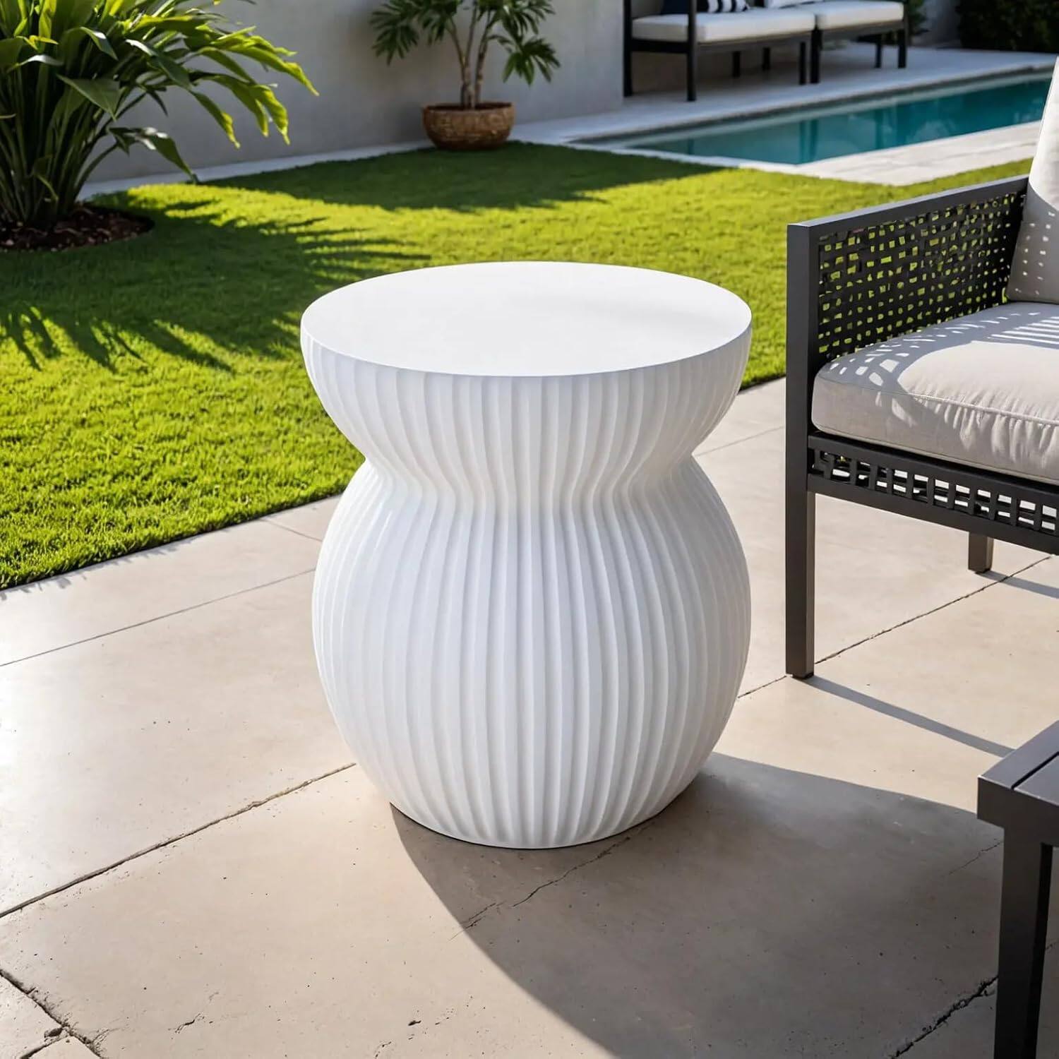 Left. LeisureMod - Mander Sculptural Hourglass Side Table - Ribbed Fiberstone Weather Resistant Outdoor Accent Table - White.