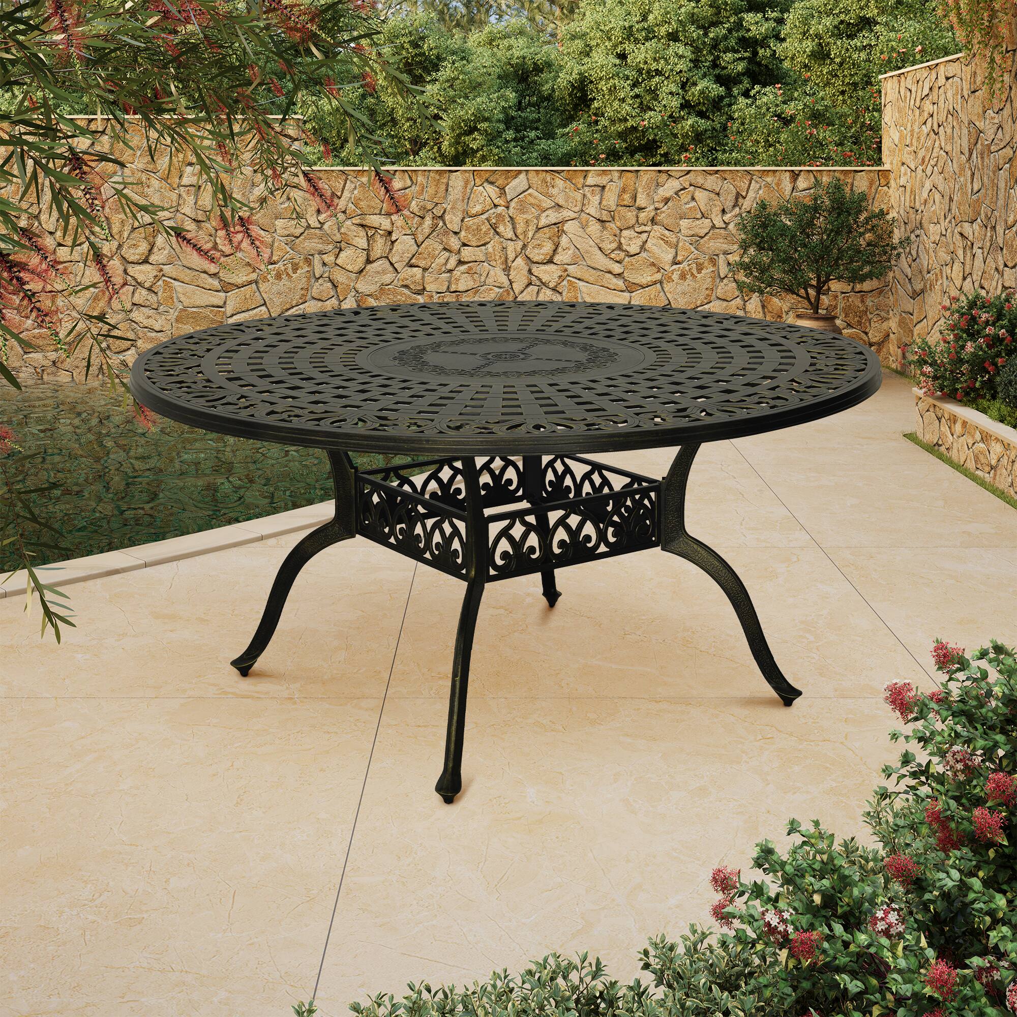 Angle. Mondawe - 59" Cast Aluminum Round Dining Table - Bronze.