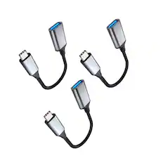 The image shows four USB adapters with a USB Type-C connector on one end and a USB Type-A connector on the other.